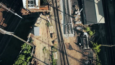Construction of a railway bridge in the metropolis. Train rides, top view Stock Footage 142128111