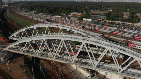 Construction of a railway bridge in the metropolis. Train rides, top view Stock Footage 142132039