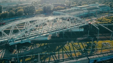 Construction of a railway bridge in the metropolis. Train rides, top view Stock Footage 142133111