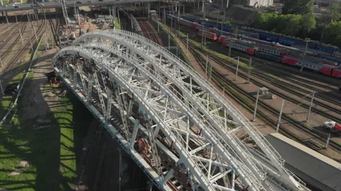 Construction of a railway bridge in the metropolis. Train rides, top view Stock Footage 142133871