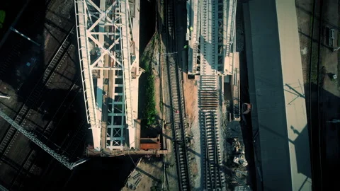 Construction of a railway bridge in the metropolis. Train rides, top view Stock Footage 142134044