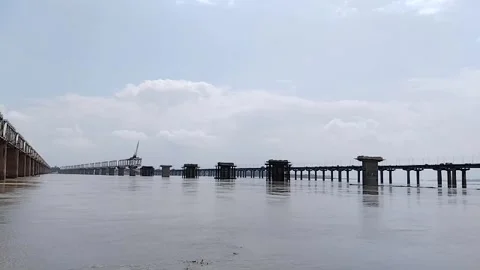 Construction of a railway bridge over the river Stock Footage 253177350