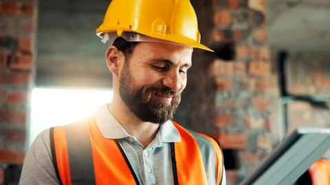 Construction, reading and man on tablet for online review, evaluation and Stock Photos