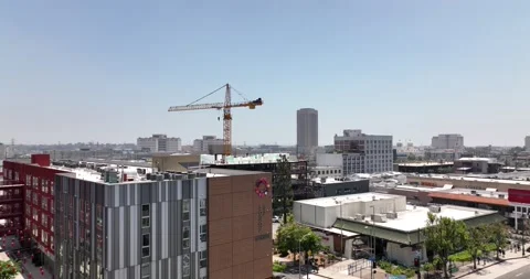 Construction, real estate, crane builds a house with office, 4K drone Stock Footage 238586276