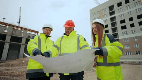Construction of real estate objects, three civil engineers are inspecting Stock Footage 204157638