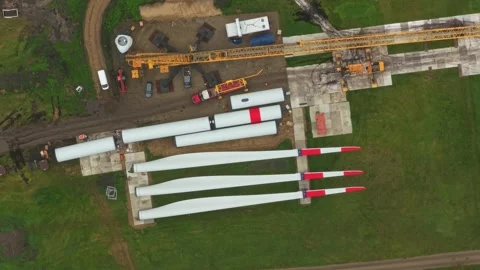 Construction of renewable energy farm seen from air, parts on land Stock Footage 320246462