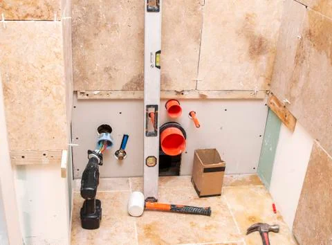 Construction repair tools on the background of stone natural tiles Stock Photos
