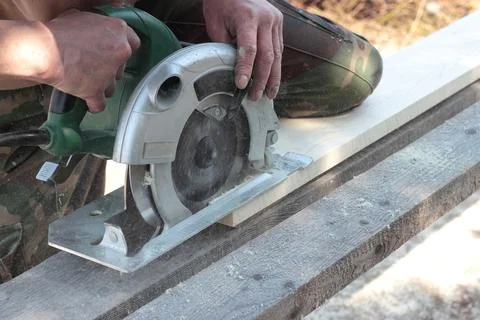 Construction, repair, tools - Work on the circular saw Stock Photos