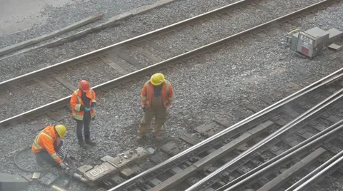Construction repair workers on train track repairing railroad Stock Footage 68999571