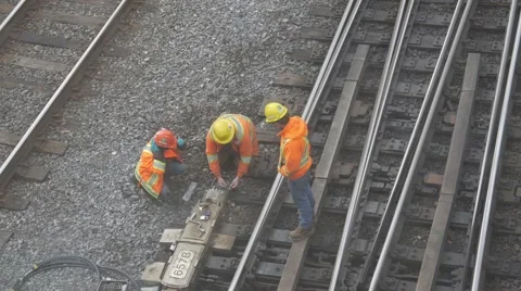 Construction repair workers on train track repairing railroad Stock Footage 68999583