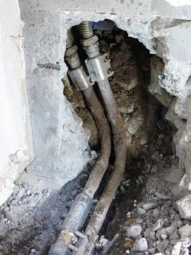 Construction to replace rusty water pipes in a house Stock Photos
