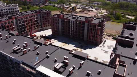 Construction of a residential building, a crane is working in the yard 스톡 동영상 197058013