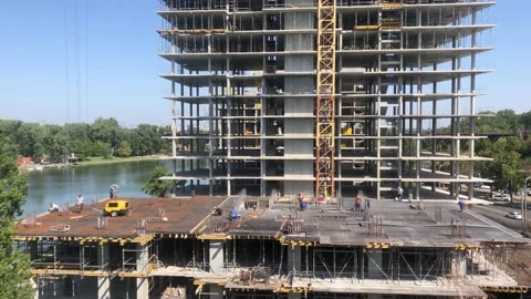 Construction of a residential building next to the river. The process of Video stock 197686930