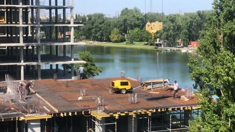 Construction of a residential building next to the river. The process of Stock Footage 199094592