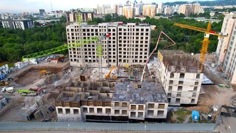 Construction of a residential complex with cranes Stock Photos
