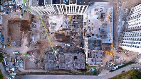 Construction of a residential complex with cranes, top view Stock Photos