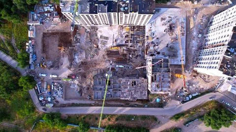 Construction of a residential complex with cranes, top view Stock Photos