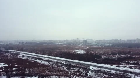 Construction of a residential complex on the outskirts of the metropolis. winter Stock Footage 169456103