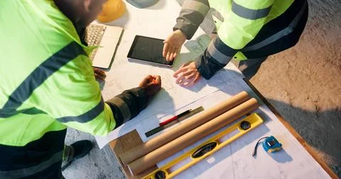 Construction, review or hands on site with blueprint, project discussion or.. Stock Photos