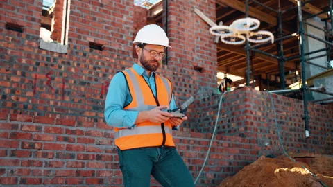 Construction, review or man outdoor with drone, structure or progress track in Stock Footage 336195066