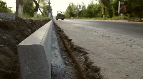 The construction of the road and installation of curbs Stock Footage 64278020