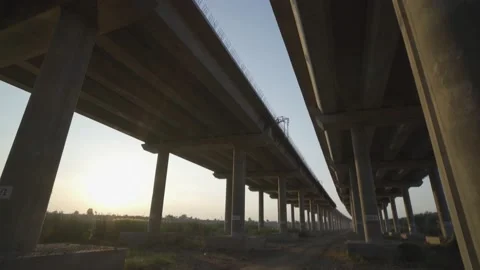 The construction of a road bridge over the highway. Stock Footage 145983280