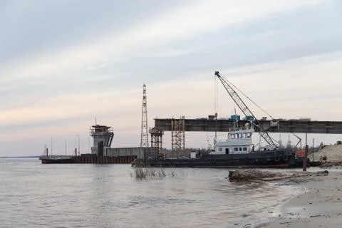 The construction of a road bridge over the river. Reinforced concrete piles. 스톡 사진