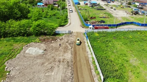 Construction of the road from a height. Work asphalt paver. Stock Footage 111528070