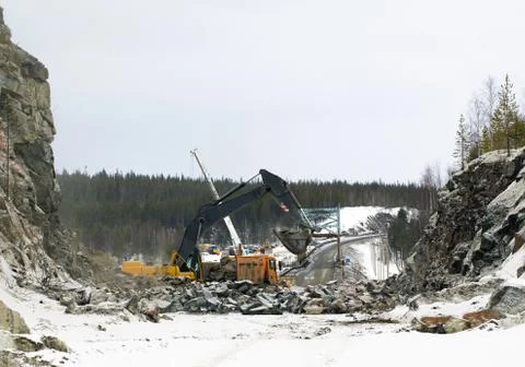 Construction of the road through the rock Stock Photos