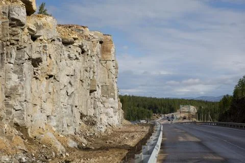 Construction of the road through the rock Stock Photos