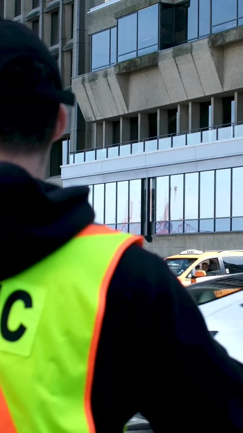 A construction road worker stopping traffic, holding a stop sign. Stock Footage 245508041