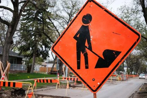 Construction Roadwork Orange Traffic Warning Sign Close-Up. Stock Photos