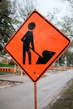 Construction Roadwork Orange Traffic Warning Sign Close-Up. Stock Photos
