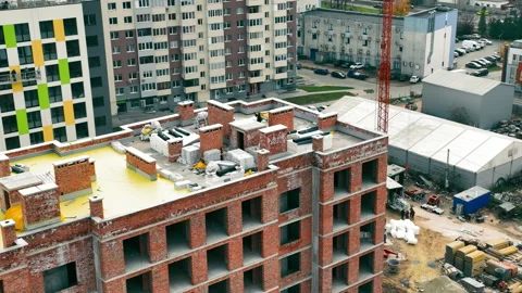 Construction on the roof of a multi-storey building from the top. Building Stock Footage 229805510