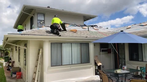 Construction Roofer Working, Nailing Secure New Shingles With Pneumatic Nail Gun Stock Footage 240572377