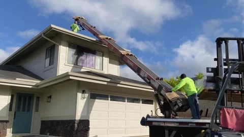 Construction Roofers Loading Shingles On Roof With Conveyer Belt Crane Machine Stock-Footage 240571918