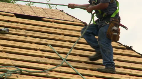 Construction Roofing walking with rope Stock Footage 52753884