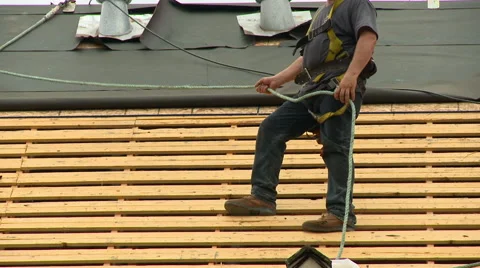 Construction Roofing worker with rope 1 Stock Footage 52751338
