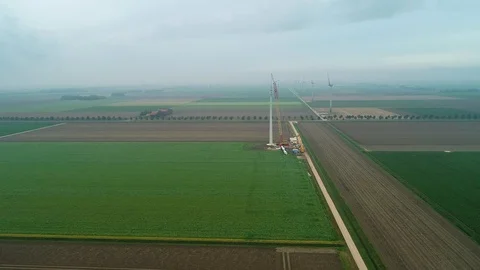 Construction of Row of Windmills with Crane in Flevoland, Netherlands / Holland  Video stock 119101997