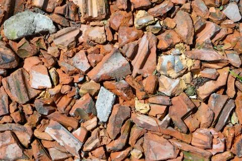Construction rubble of old red tiles gives a harmonic background Stock Photos