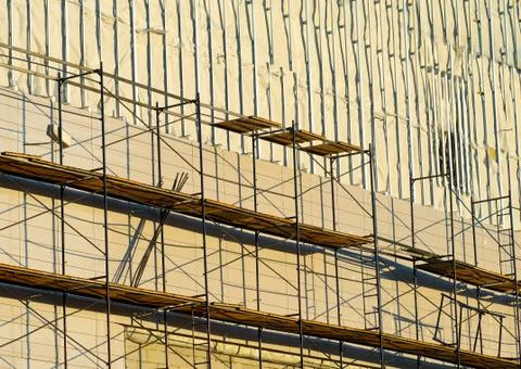 Construction scaffold during sunset time backdrop Foto stock