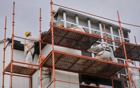 Construction scaffolding on the front of the building. Stock Photos