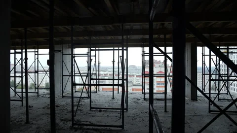 Construction scaffolding inside unfinished concrete building structure Stock Footage 318779964