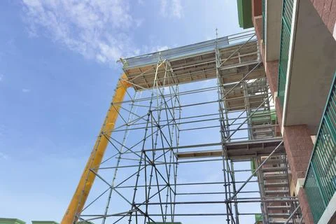 Construction scaffolding structure against blue sky 库存照片