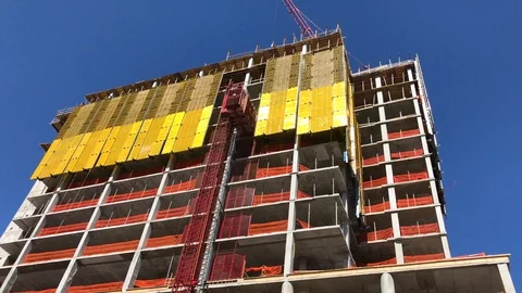 Construction scene with elevator moving between floors Stock Footage 88976086