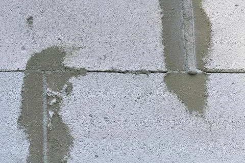 Construction seam.Joint between two concrete blocks, sealed with cement Stock Photos