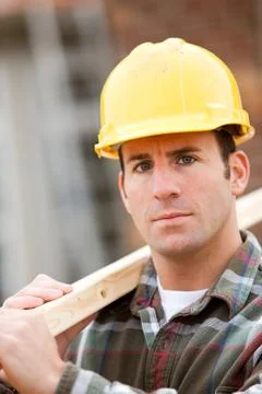 Construction: serious worker on home site Stock Photos
