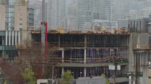Construction set and builders in Vancouver on a rainy day time-lapse 4K Stock Footage 195111453