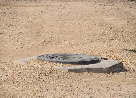 Construction of sewer hatches. Sewer Stock Photos