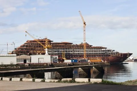 Construction of a ship in the shipyard of Vigo with cranes and scaffolds Stock Photos